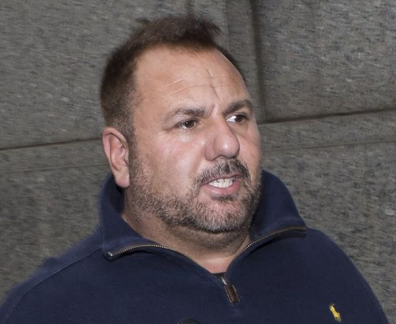 Peter Senese in a very different setting, after leaving court after posting bail, looking disheveled and unshaven