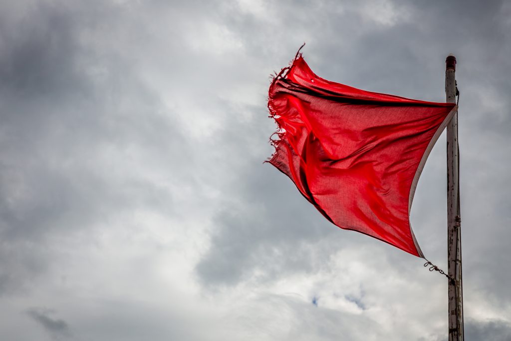 Header image: red flag (credit: John-Kelly at Shutterstock.com)