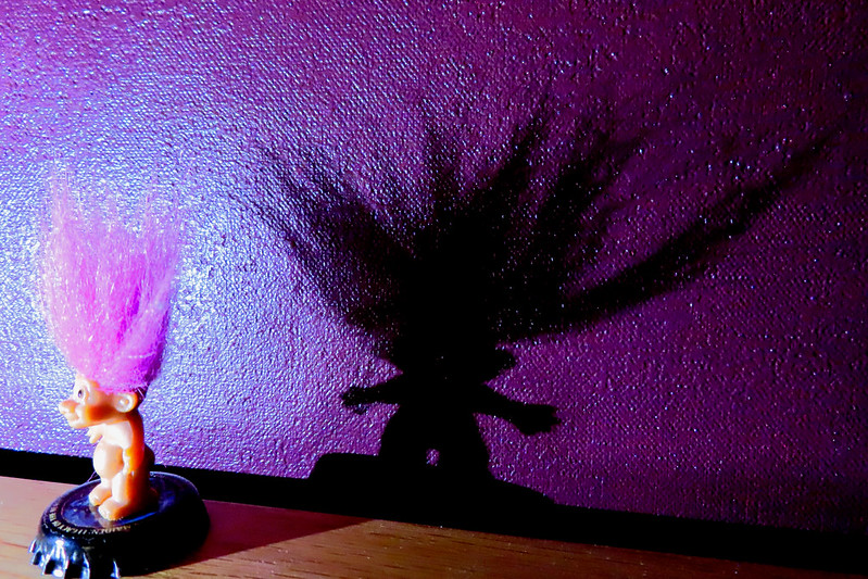 Header image: Troll casting dark shadow on a purple background (credit:  -Cheesyfeet- / Flickr.com)
