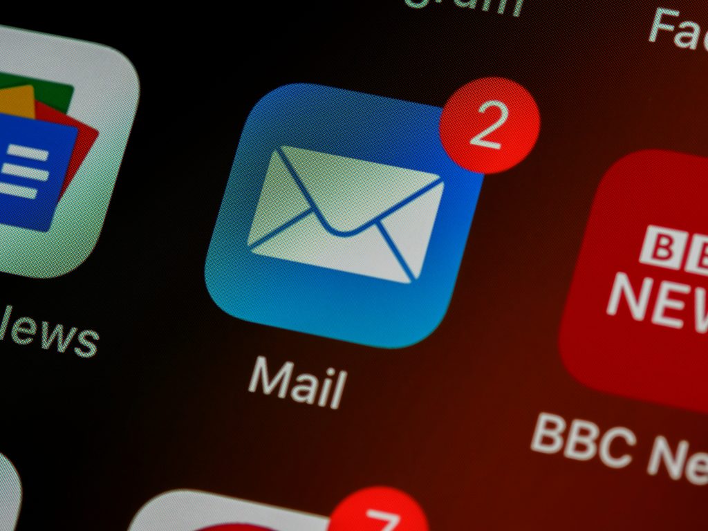 Header image: partial image of an iPhone screen showing the email symbol, a white envelope on a blue button (Credit: Brett Jordan / Unsplash.com)